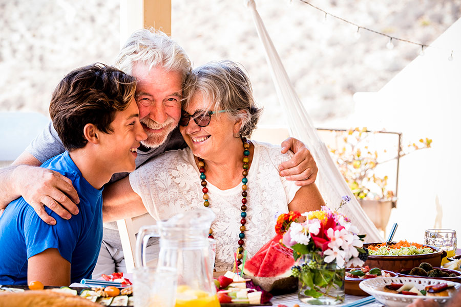 Happy family hugging each other, symbolizing support and care while discussing top cataract questions and answers together.
