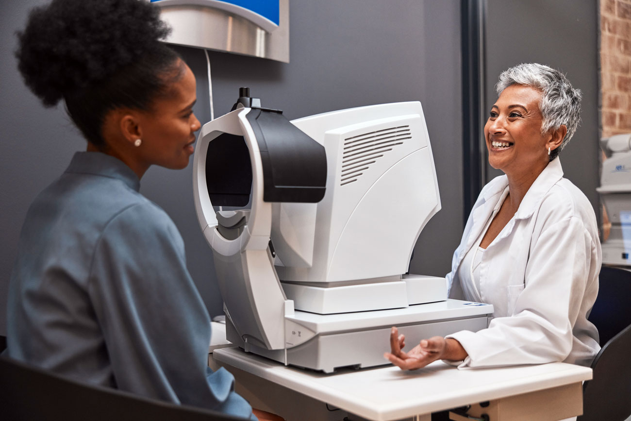 Ophthalmologist discussing preoperative measurements with a patient before cataract surgery