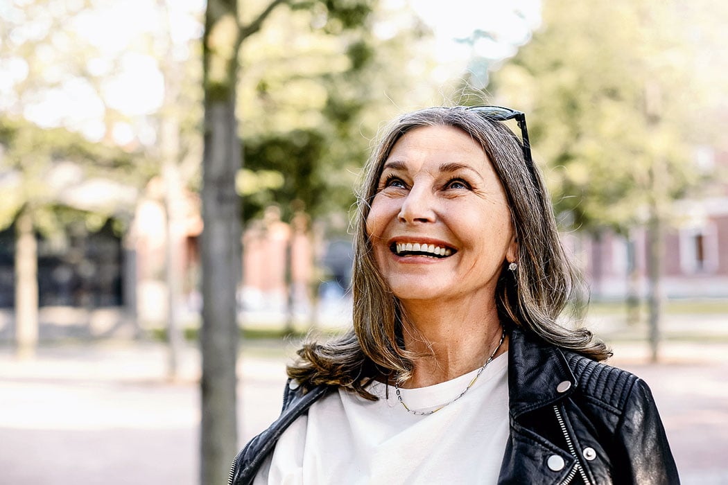 Happy mature woman enjoying clear vision after preparing for cataract surgery