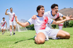 Soccer players celebrating a goal—LASIK for soccer players in El Paso with clear vision after surgery