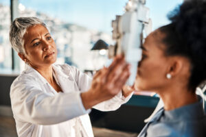 Prepare for your appointment with a patient undergoing a comprehensive eye exam as an eye care professional uses diagnostic equipment to evaluate vision and eye health.