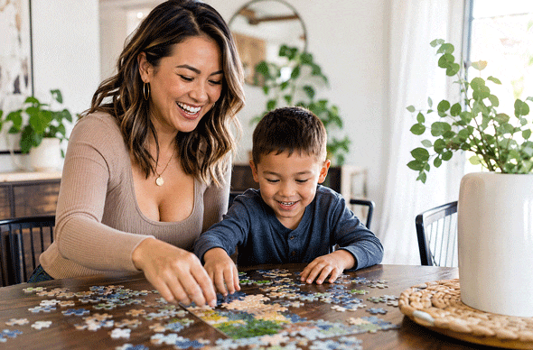 Mom and son putting a puzzle together after mom found dry eye treatment in El Paso at West Texas Eye Associates.