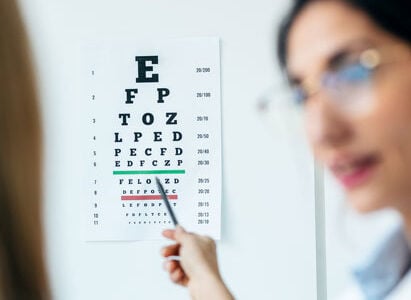 Example of an ophthalmic assistant conducting an eye exam