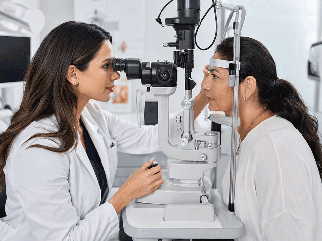 Southwest Eye Institute ophthalmologist performing an emergency eye care examination with a slit lamp.